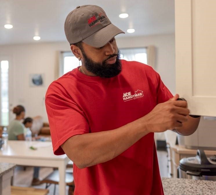 handyman repairing cabinet